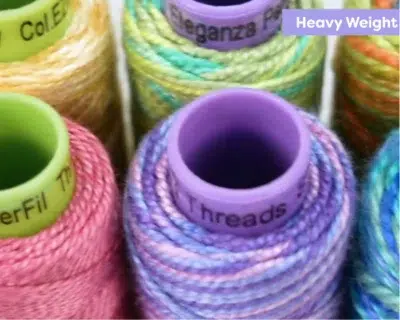 Heavy weight embroidery thread spools in multiple colors for bold textured embroidery Heavy weight embroidery thread spools in multiple colors for bold textured embroidery