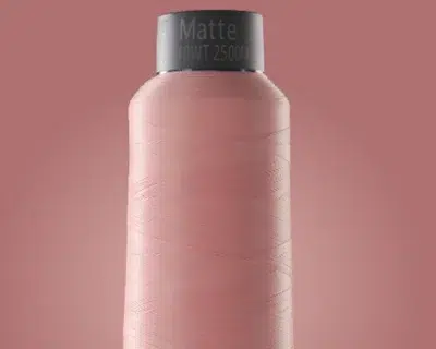 Matte embroidery thread spool in soft pink color Matte embroidery thread spool in soft pink color