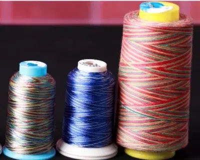 Variegated embroidery thread spools with multicolor blends for decorative machine embroidery Variegated embroidery thread spools with multicolor blends for decorative machine embroidery