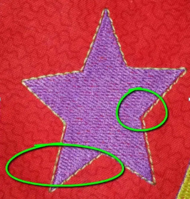 Poor push and pull compensation causing outline gaps in a star embroidery design. Poor push and pull compensation causing outline gaps in a star embroidery design.