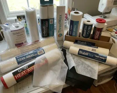 Different stabilizers for machine embroidery including tear-away, cut-away, wash-away, and heat-away types