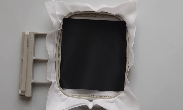 Fabric and stabilizer secured inside an embroidery hoop Fabric and stabilizer secured inside an embroidery hoop