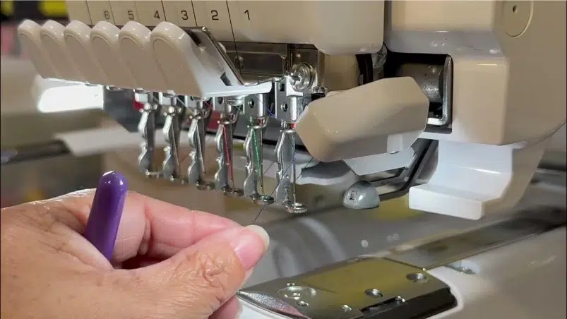 Threading a multi needle machine Threading a multi needle machine